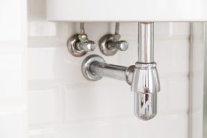 Basin siphon or sink drain in a bathroom, clean in Mango, FL