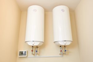 Two electric water heaters on the wall. Home wall mounted two water heating boilers in Brandon, FL